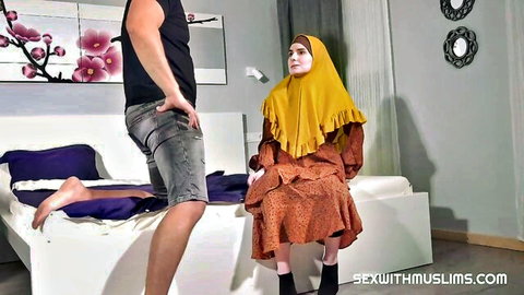 Muslim hijabi woman in yellow scarf sits as man grips her hips for anal tease