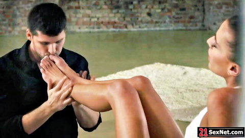 Man sucks toes of petite girlfriend during intimate moment