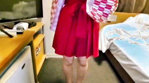 Sexy Asian babe in short red kimono dress teasing legs in hotel room