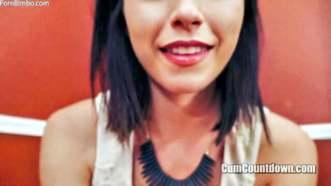 Smiling brunette femdom mistress in white tank top teases with red lips for cum countdown JOI