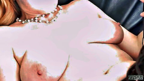 Blonde with large natural tits and pearl necklace exposing bare breasts closeup