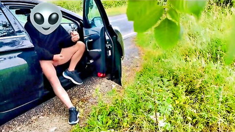 Alien-masked guy spreads thighs teasing from open car door roadside public outdoor gay