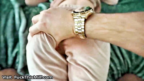 Man's hand with gold watch grips pale MILF's inner thigh spreading her legs exposing pink pussy