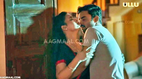 Busty Indian woman passionately kissing man in Tamil erotica scene