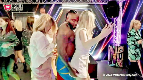 Blonde woman dances provocatively on muscular black man at wild girls party