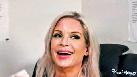 Miss Sally smiling with cum facial in sexy office attire