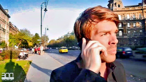 Red-haired man in suit on phone in sunny urban street, Eva Parcker adult video teaser