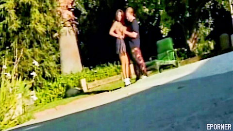 Blonde woman topless in outdoor sex with man, perky tits exposed