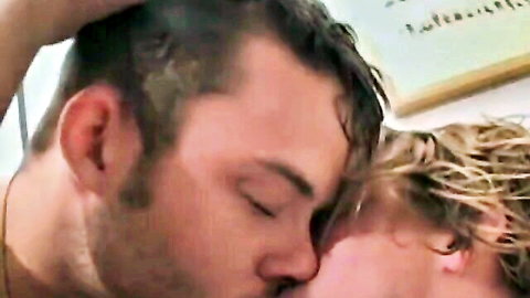 Bushy bearded man kissing blond guy in gay anal prep scene