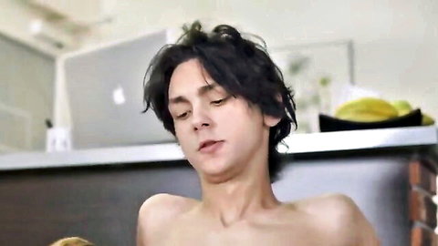 Intense young twink with dark hair in bare-chested gay sex scene