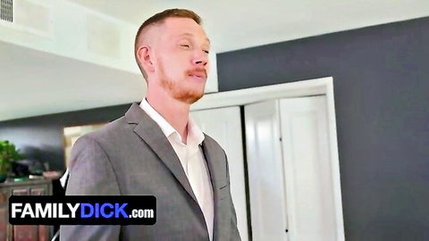 Suited freckled ginger DILF smirking seductively in modern bedroom at FamilyDick