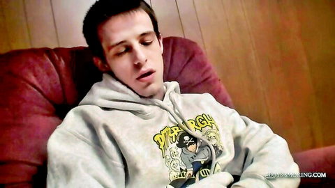 Smooth muscular twink solo in gray hoodie, relaxed expression