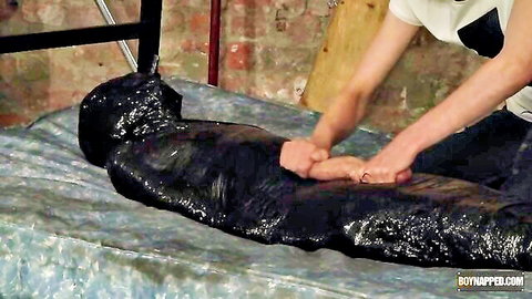 Ashley Bradley dominates wrapped sub in kinky latex handjob on big black dong