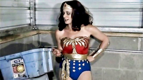 Crimson as Wonder Woman in superheroine cosplay ryona match