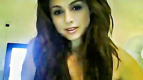 Stunning 18-year-old brunette babe smiling seductively on webcam