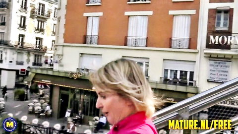 Mature blonde Camille in pink top outdoors with Cintya Aston
