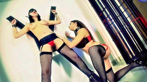 Kinky Asian lesbians in intense bondage play, topless with red lingerie and stockings