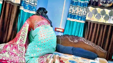 Naughty Indian babe in colorful saree bent over doggy style teasing pussy on bed