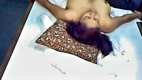 Nude Indian housewife lying seductively, ready for titjob action