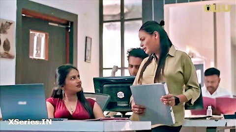 Indian office babe in red top and colleague in blouse, teasing professional vibe