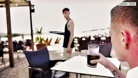 Muscular tattooed guy eyes redhead server at beach bar in bisexual setup