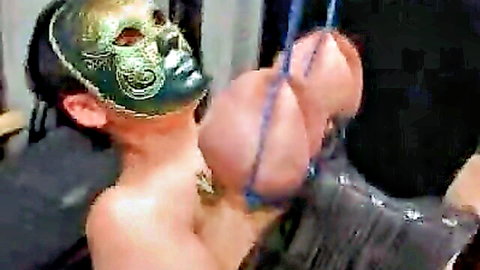 Masked big-titted slave bound by ropes in torment