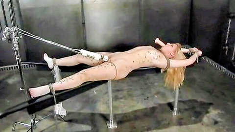 Bound blonde slave tormented with vibrators and dildos in BDSM domination