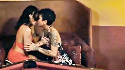 Tattooed brunettes passionately kissing on couch in steamy lesbian foreplay