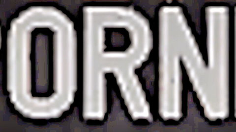 Bold glowing PORNO text sign in neon style on black background