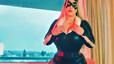 Curvy blonde in Catwoman leather outfit teases massive tits in solo POV