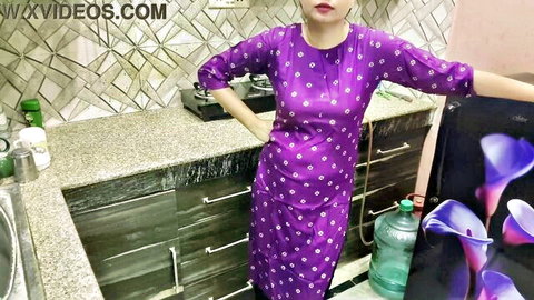 Sexy Indian bhabhi in purple salwar kameez posing seductively