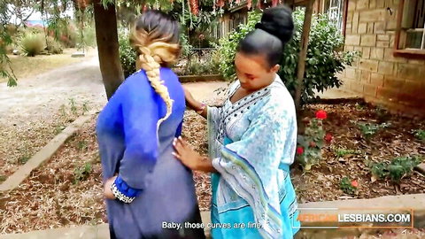 Amateur ebony lesbians in sheer outfits touching intimately outdoors