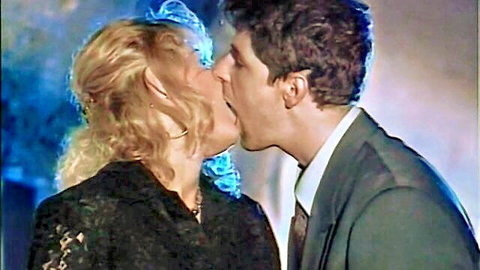 Draghixa Laurent intense kiss with man in suit, black lace top, 1996 classic