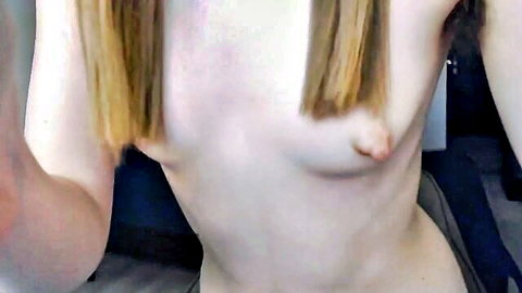 Blonde babe teasing with perky nipples in topless close-up