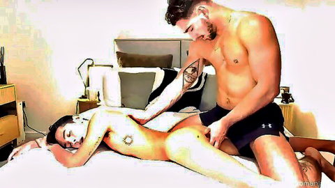 Interracial muscular top dominating slim nude bottom boy in gay bedroom scene