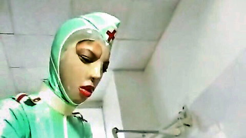 Kinky latex nurse in green fetish outfit dominates in CFNM scene