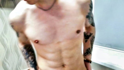 Tattooed muscular Filipina kinkster showing toned abs on webcam