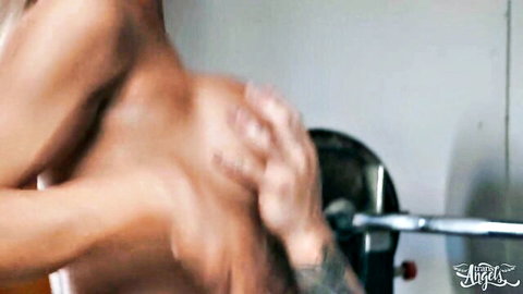 Angellica Good muscular arms gripping barbell in intense gym tease