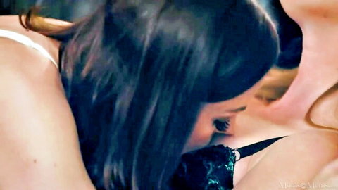 Two women in lingerie embrace intimately in lesbian scene