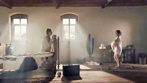 Caroline Dhavernas in sheer white gown and robe in seductive scene