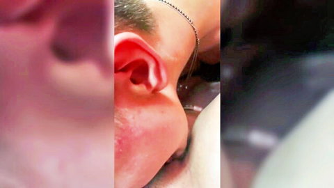 Close-up of two women intimately kissing necks in lesbian mall dressing room