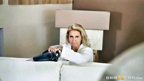 Ryan Conner blonde MILF in white robe, seductive pose on couch
