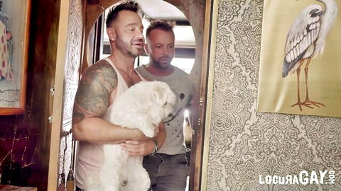 Tattooed Spanish guy holds cute white dog while UK amateur buddy watches in hot gay tease