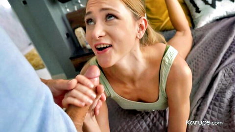 Skinny blonde teen with small tits surprised as man pulls ponytail and holds thick cock to her open mouth on bed