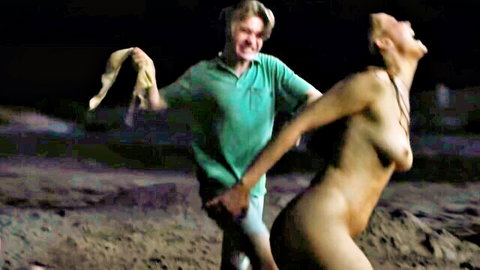 Naked blonde with big tits bent over as clothed guy grabs her tight ass outdoors at night