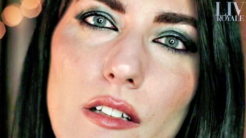 Seductive brunette with green eyeshadow and glossy lips opens mouth wide teasing for dirty talk blowjob