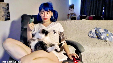 Petite camgirl TheySaidimcute with blue hair and cat on lap in t-shirt