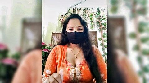Payel Sen in orange embroidered top, cleavage tease in dirty talk strip chat