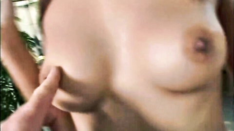 Man's hand pinching erect nipple on woman's huge pale breast closeup