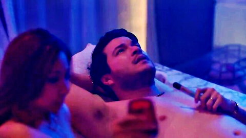 Asian couple in intimate bedroom moment, shirtless man and woman